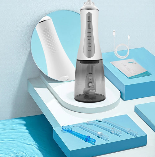 Cordless water flosser in white with gray tank